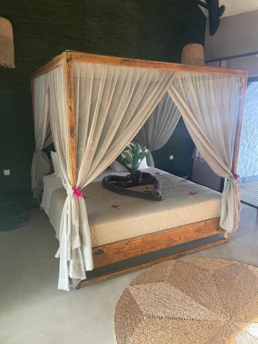 Postel nebo postele na pokoji v ubytování Mukumbura Lodge Bilene