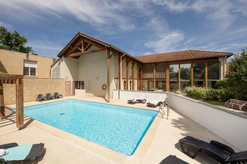 a swimming pool in the backyard of a house at Garden & City Lyon - Marcy in Marcy-lʼÉtoile