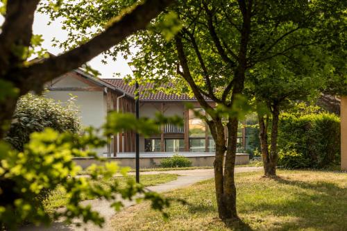 a house with trees in front of it at Garden & City Lyon - Marcy in Marcy-lʼÉtoile