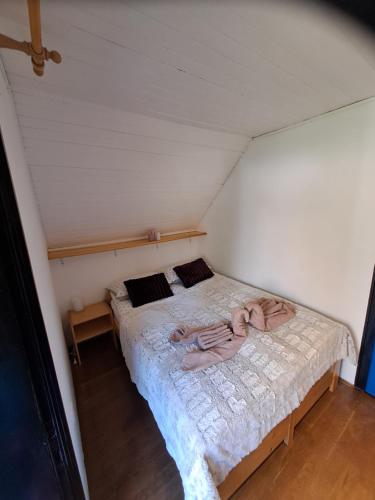a small bedroom with a bed in a attic at Holiday home Pri Metki - Bohinj in Bohinj