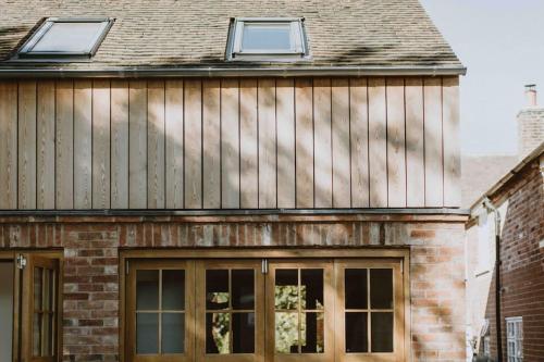 a house with two windows on top of it at The Barn in Nottingham