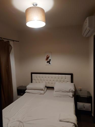 Giường trong phòng chung tại Home Vacation in Porto Sharm