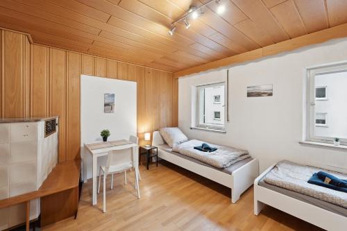 En eller flere senger på et rom på Work & Stay Apartments near Stuttgart