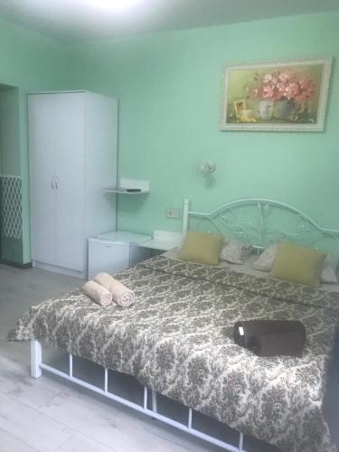 a bedroom with a large bed with pillows on it at Villa Galicia in Berehove
