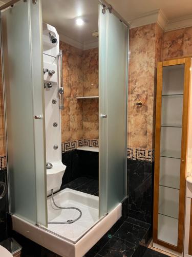 a shower with a glass door in a bathroom at La casa de Lola in Caleta De Velez