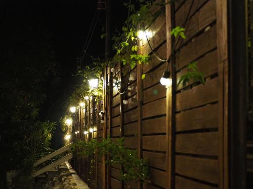 a fence with lights on it at night at Chomklong Experience in Pak Chong
