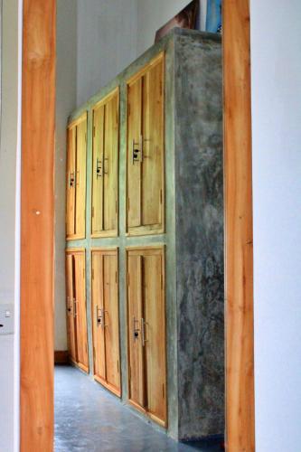 a row of wooden cabinets in a room at Pranaya Hiriketiya in Hiriketiya