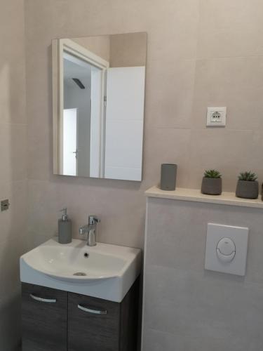 a bathroom with a sink and a mirror at Holiday home in Selca with terrace, air conditioning, WiFi, washing machine 5094-1 in Selca