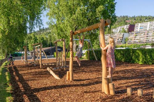 two girls playing on a playground in a park at Topcamp Bogstad - Oslo in Oslo