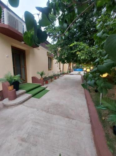 a courtyard of a house with plants and trees at Ambiennt in Bucharest