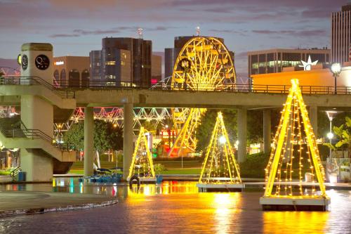 a group of christmas trees in front of a bridge at Hyatt Regency Long Beach in Long Beach
