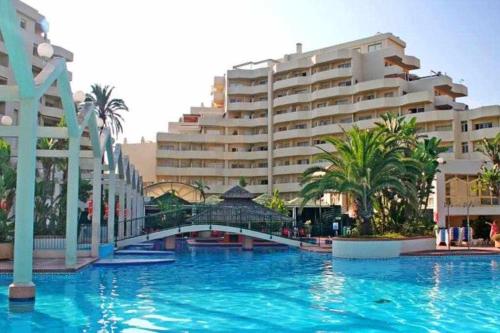 a large swimming pool in front of a large building at Benal Beach 907 in Benalmádena
