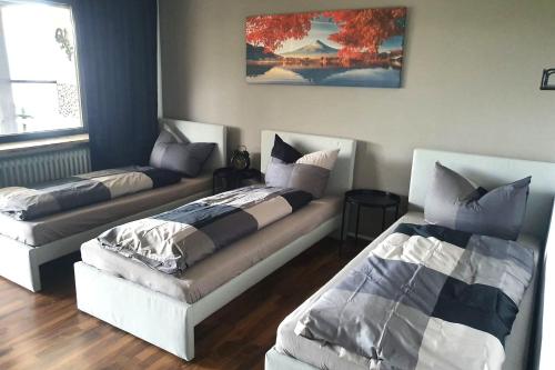a living room with two beds and a couch at Work & stay apartment with balcony near Ingolstadt in Großmehring