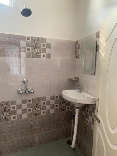 Ένα μπάνιο στο Aama Home Stay