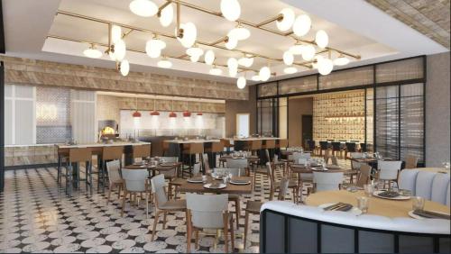 a rendering of a restaurant with tables and chairs at Hyatt Regency Baytown-Houston in Baytown