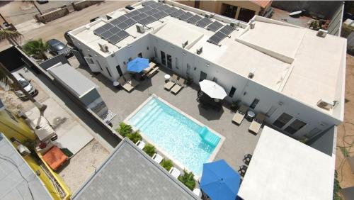 an aerial view of a house with a swimming pool at Bida Marino Residence Aruba in Palm-Eagle Beach
