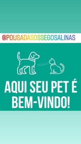 a sign with a picture of a dog at Pousada Sossego Salinas in Salinópolis