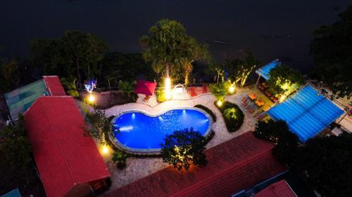 an overhead view of a swimming pool at night at D&D riverside Homestay in Xuân Sơn