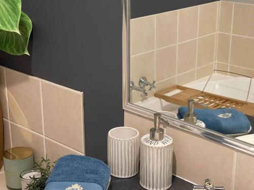 a bathroom with a sink and a mirror at Peaceful Brand New Holiday house in North Lakes in North Lakes