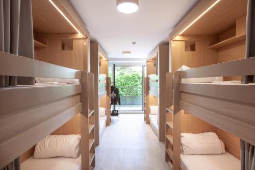 a row of bunk beds in a dorm room at The People - Paris Bercy in Paris