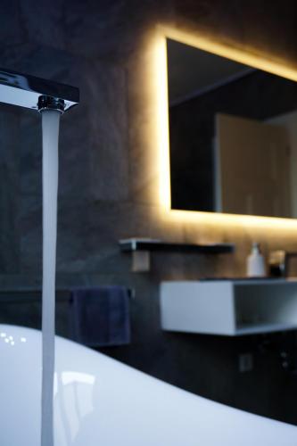 a bathroom with a sink and a mirror at Parkresidenz Lychen, Ferienwohnung 5 in Lychen