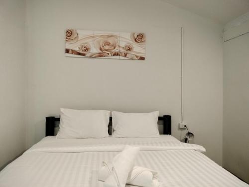 Postel nebo postele na pokoji v ubytování Namthip Homebeach