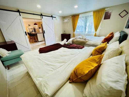 a bedroom with two large beds with pillows at Vila Montana Valiug in Văliug