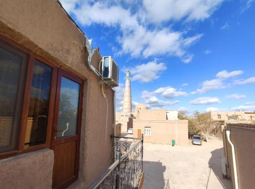 a view of a mosque from a balcony of a building at Khiva Tosh Darvoza in Khiva