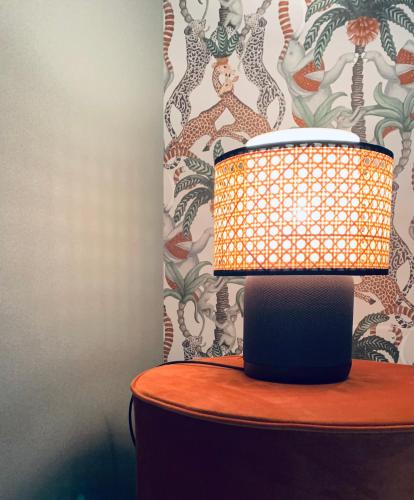 a lamp sitting on top of a table at Smallis Apartment in Conversano