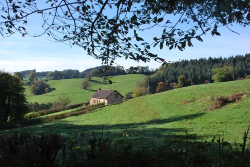 a house on a hill in a green field at Maison Montcharmont in Étang-sur-Arroux