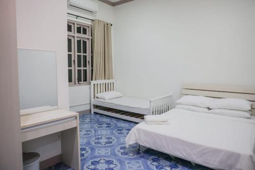 Postel nebo postele na pokoji v ubytování Riyaludhathuru Maldives