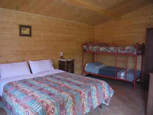 A bed or beds in a room at Su Trabi B&B