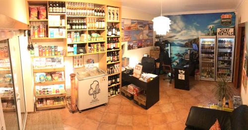 a room with a store with a lot of products at 33 Hostel in Baleal