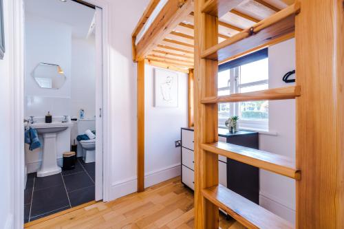 a bathroom with a sink and a toilet in a room at Lovely 2-bed house in Chester by 53 Degrees Property, Ideal for Couples & Small Groups, Amazing Location - Sleeps 4 in Hough Green