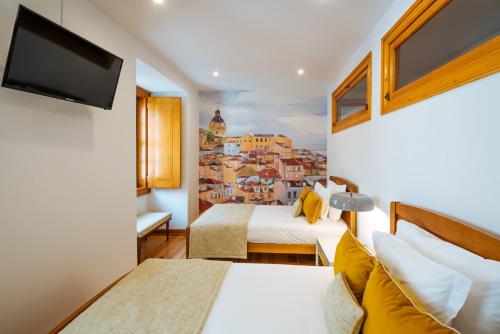 Postel nebo postele na pokoji v ubytování Varandas de Lisboa - Tejo River Apartments & Rooms