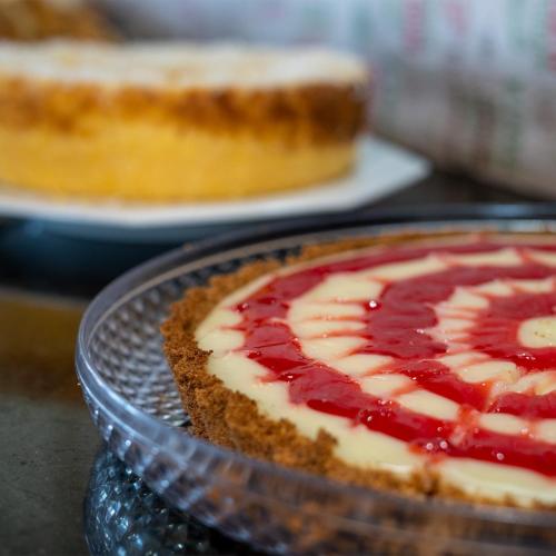 a pie sitting on a glass plate on a table at Pousada Bellissima Italia in Luis Correia