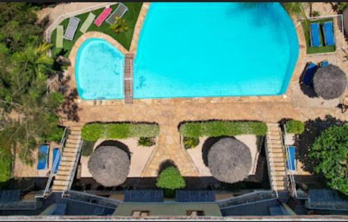 an aerial view of a house with a swimming pool at Jua Apartments in Kiwengwa