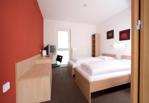 Postel nebo postele na pokoji v ubytování Motel Angern