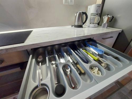 a drawer filled with utensils in a kitchen at Veria Panorama Luxury Suite with Garden 2 in Veria