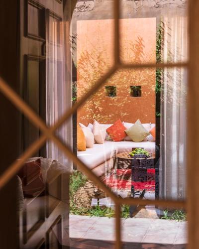 a view of a bed through a window at Berbère Palace in Ouarzazate