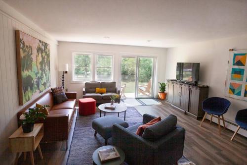 a living room with a couch and a table at 1 Mile to Hunter Mt! Cozy 3 Bedroom in Hunter
