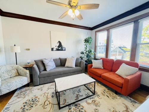 a living room with two couches and a ceiling fan at The Karlov. Gorgeous ,spacious 2BD/ 1BA w/ Parking in Chicago