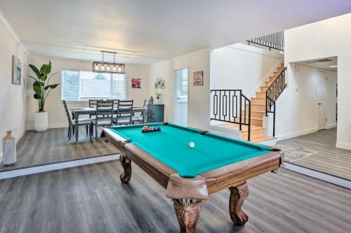 a living room with a pool table and a staircase at Relax Fireside and Play Pool! Home 4 Mi to Dtwn Reno in Reno
