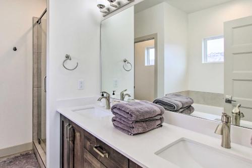 a white bathroom with a sink and a mirror at Eden Home with Stunning View about 6 Mi to Skiing! in Eden