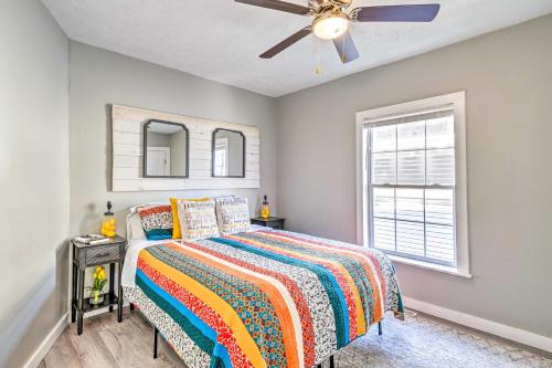 a bedroom with a bed and a ceiling fan at Pet-Friendly Indianapolis Townhome with Yard! in Indianapolis