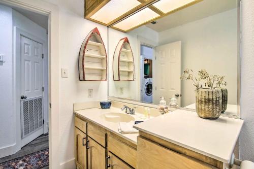 a bathroom with a sink and a mirror at South Padre Island Getaway - Newly Renovated! in South Padre Island