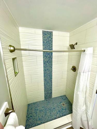 a bathroom with a shower with a glass door at St Thomas - Waterfront Penthouse sleeps 16 w Pool & Boat Dock in Key West