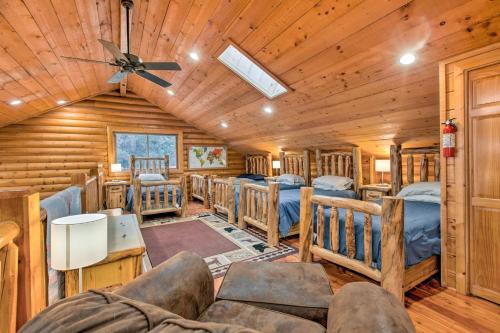 a cabin with bunk beds in a room with a ceiling at Mtn Retreat in Angel Fire - Ride 4 Blocks to Lift! in Angel Fire