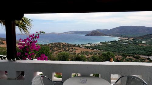 a view of the ocean from the balcony of a house at Castri Village Hotel in Palekastron