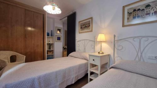Postel nebo postele na pokoji v ubytování Apartamento vacacional Marita